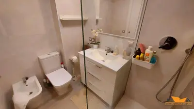 a small bathroom with a toilet and a sink at Pobla-Mar in Valencia