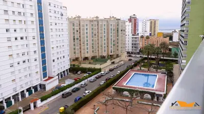 an aerial view of a city with a swimming pool at Pobla-Mar in Valencia