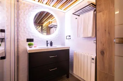 a bathroom with a sink and a mirror at Encantador Loft a un Paso del Río Turia in Valencia