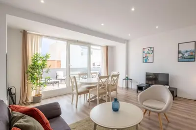 a living room with a couch and a table at Spacious Penthouse with Private Terrace in Valencia