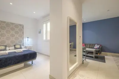 a bedroom with a bed and a mirror at Sunny,Private Terrace,Wheelchair access in Valencia