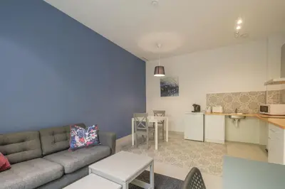 a living room with a couch and a kitchen at Sunny,Private Terrace,Wheelchair access in Valencia
