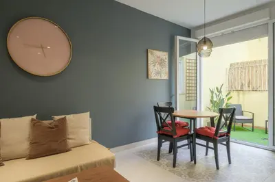 a room with a bed and a table and chairs at Chic & Comfortable Apartment, Private Terrace in Valencia