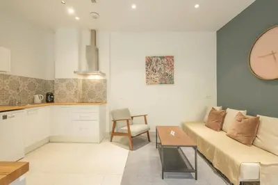 a living room with a couch and a table at Chic & Comfortable Apartment, Private Terrace in Valencia