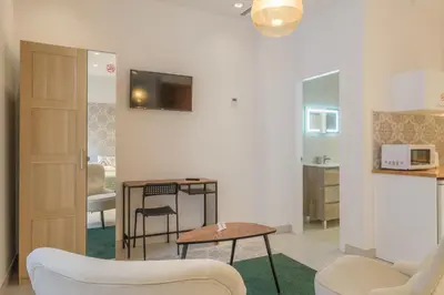 a living room with a couch and a table at Gorgeous Apartment close to City Centre in Valencia
