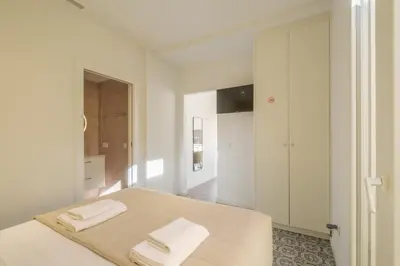a bedroom with a bed with two towels on it at Marvellous Apt with a Large Private Terrace in Valencia