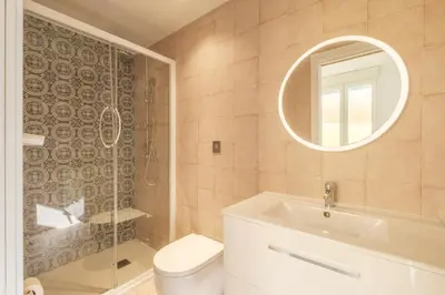 a bathroom with a toilet and a sink and a mirror at Marvellous Apt with a Large Private Terrace in Valencia