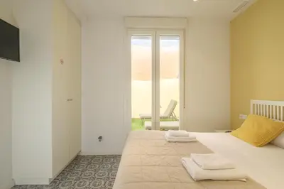 a bedroom with a bed with two towels on it at Marvellous Apt with a Large Private Terrace in Valencia