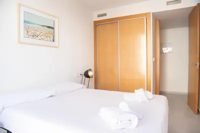a hotel room with a bed with towels on it at VLC HOST - Cuber in Valencia