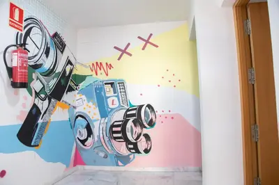 a room with a painting of a camera on the wall at VLC HOST - Cuber in Valencia