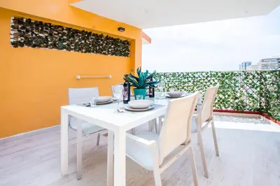 a white dining room table with white chairs at PRIMERISIMA LINEA DE PLAYA - CULLERA BAHIA DE LOS NARANJOS I in Cullera