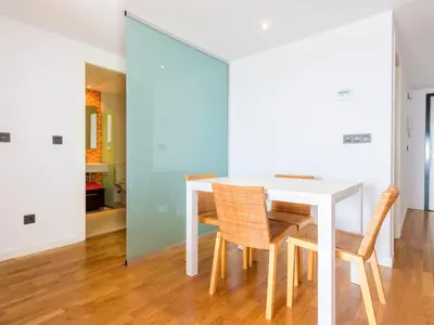 a dining room with a white table and chairs at Apartment Porte Venere by Interhome in Moncófar