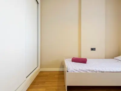 a bedroom with a bed with a purple pillow on it at Apartment Porte Venere by Interhome in Moncófar