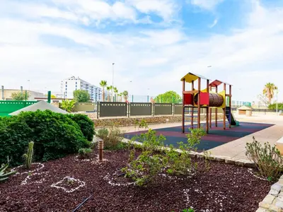 a playground with a slide in a park at Apartment Porte Venere by Interhome in Moncófar