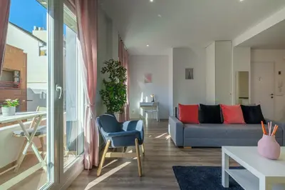a living room with a couch and a table at Modern, Stylish Apartment in Valencia