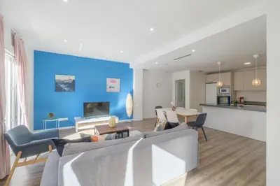 a living room with a couch and a table at Modern, Stylish & Comfortable Apartment in Valencia