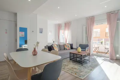 a living room with a couch and a table at Modern, Stylish & Comfortable Apartment in Valencia