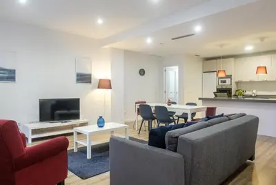 a living room with a couch and a table at Apartment With Super Comfortable Beds in Valencia