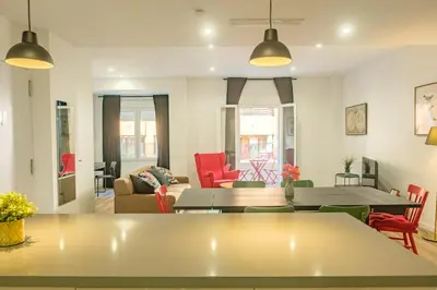 a living room with a table and chairs at Clean & Very Comfortable Apartment in Valencia