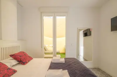 a bedroom with a bed and a window at Gorgeous Apt with a Large Private Terrace in Valencia