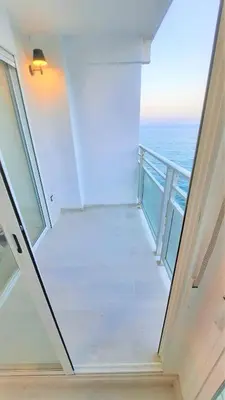 a view of the ocean from a balcony of a building at Fantastico apartamento Faro de cullera a primera linea mar abierto playa de los olivos in Faro de Cullera