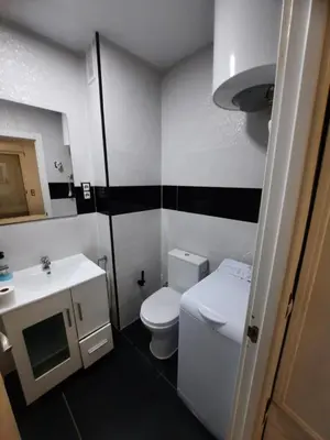 a small bathroom with a toilet and a sink at Fantastico apartamento Faro de cullera a primera linea mar abierto playa de los olivos in Faro de Cullera