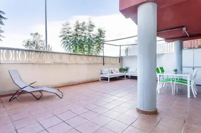 a patio with a table and chairs on a balcony at Balcón del Mar in Canet de Berenguer