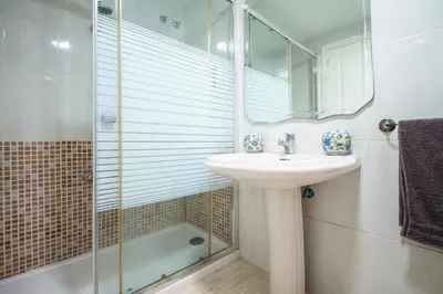 a bathroom with a sink and a shower at ESPACIO 2 Primera LINEA DE PLAYA in Cullera