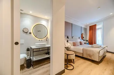 a hotel room with a bed and a sink at Soho Boutique Turia in Valencia