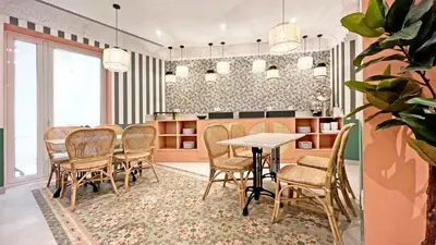 a dining room with a table and chairs at Soho Boutique Turia in Valencia