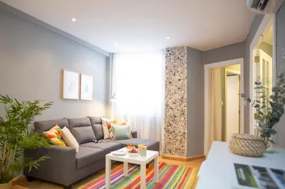 a living room with a couch and a table at SingularStays Baleares in Valencia