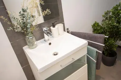a bathroom with a white sink and a mirror at SingularStays Baleares in Valencia