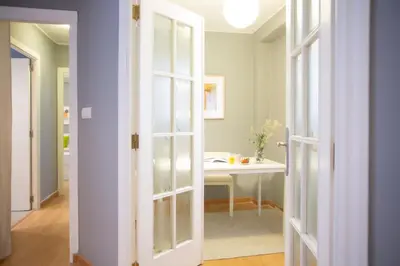 a door leading into a room with a table at SingularStays Baleares in Valencia