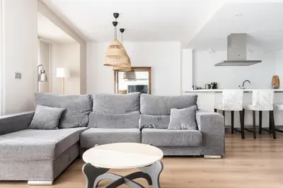 a living room with a couch and a table at Casa señorial en el corazón del Puerto by Hometels in Puerto de Sagunto