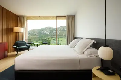 a bedroom with a large bed with a large window at La Galiana Golf Resort - Adults Only in Barraca de Aguas Vivas