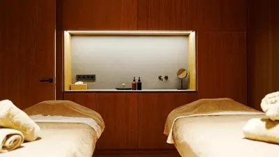 two beds in a room with a mirror at La Galiana Golf Resort - Adults Only in Barraca de Aguas Vivas
