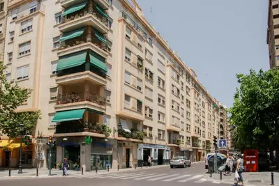 a large building on a city street with a street at Apartamentos FV Flats Valencia - Mestalla 9 in Valencia