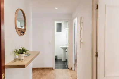 a bathroom with a sink and a mirror at Apartamentos FV Flats Valencia - Mestalla 9 in Valencia