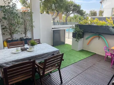 a patio with a table and chairs on a balcony at PLAYA ALMARDA,PISCINA,2 TERRAZAS,WIFI,PARKING,BBQ,TRANQUILo in Sagunto