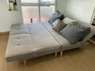 a large bed in a room with a large window at PLAYA ALMARDA CORINTO, PISCINA, WIFI,2 TERRAZAS, BARBACOA,TRANQUILo in Sagunto