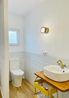 a bathroom with a sink and a toilet at Torbellino de Colores in Benaguacil