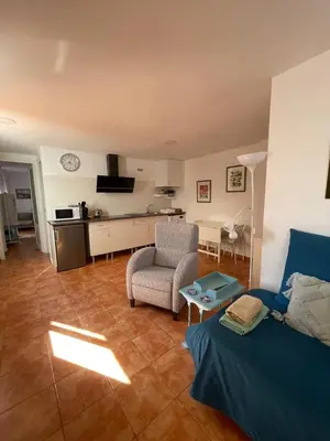 a living room with a bed and a kitchen at Apartamento Valencia in Catarroja