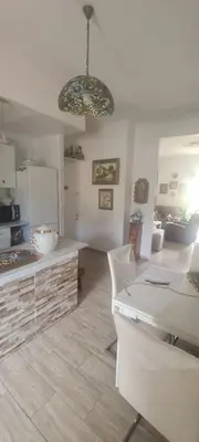 a kitchen with a table and a counter top at VALENCIA in Valencia