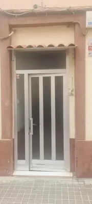 a sliding glass door of a building at VALENCIA in Valencia