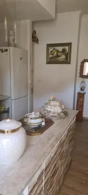 a kitchen with a counter top with a refrigerator at VALENCIA in Valencia