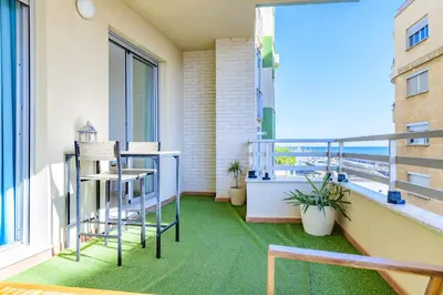 an apartment balcony with a view of the ocean at Apart. Port Arenal con terraza y piscina in Burriana