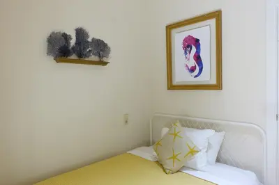 a bedroom with a bed and a picture on the wall at Best Valencia Beach Flat Historic Area next to the Beach in Valencia