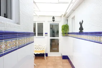 a patio with a white table and chairs at Best Valencia Beach Flat Historic Area next to the Beach in Valencia