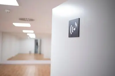 an empty room with a sign on a wall at micampus Avenida del Puerto - Residencia de Estudiantes in Valencia