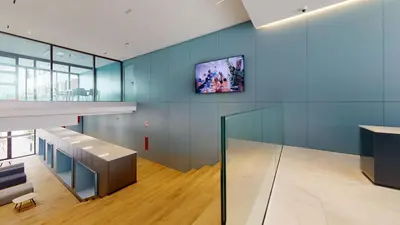 a room with blue walls and a tv on the wall at micampus Avenida del Puerto - Residencia de Estudiantes in Valencia